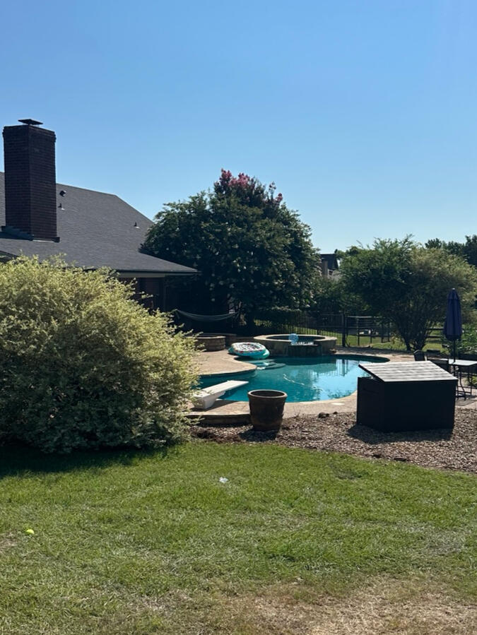 Completed exterior cleanup with open poolside space